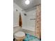 Cozy bathroom featuring a tiled tub/shower combo and colorful starfish themed curtain at 225 Country Club Dr # 1104, Largo, FL 33771