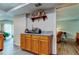 Kitchen area featuring light wood cabinets, granite counters, and stainless steel toaster oven at 225 Country Club Dr # 1104, Largo, FL 33771
