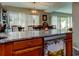 Open concept kitchen looking into the dining area and windows at 225 Country Club Dr # 1104, Largo, FL 33771