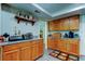 Kitchen featuring wood cabinets, granite countertops and stainless appliances at 225 Country Club Dr # 1104, Largo, FL 33771