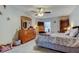 Spacious main bedroom featuring a ceiling fan, dresser, and ample natural light at 225 Country Club Dr # 1104, Largo, FL 33771