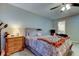 Cozy main bedroom showcasing neutral walls, plush carpeting, and a comfortable bed at 225 Country Club Dr # 1104, Largo, FL 33771