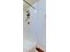 Clean, bright shower featuring white tile, shower caddy, and bronze fixtures at 225 Country Club Dr # 1104, Largo, FL 33771