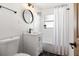 Clean bathroom featuring a modern vanity, toilet, and tub with shower at 331 Barbara Cir, Belleair, FL 33756