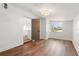 Bedroom features wood floors, white walls, and a window at 331 Barbara Cir, Belleair, FL 33756