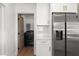Convenient laundry room with modern appliances conveniently located off the kitchen at 331 Barbara Cir, Belleair, FL 33756