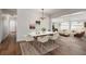 Spacious dining room opens to a comfortable living room, creating an ideal space for entertaining and relaxation at 331 Barbara Cir, Belleair, FL 33756