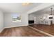 Open-concept layout showcasing a modern living room and adjoining kitchen with an eat-in breakfast bar at 331 Barbara Cir, Belleair, FL 33756