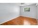 Bedroom with hardwood floors, a ceiling fan, and one window allowing ample natural light at 3409 W El Prado Blvd, Tampa, FL 33629