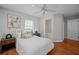 Bedroom features hardwood floors and an ensuite bathroom at 3409 W El Prado Blvd, Tampa, FL 33629