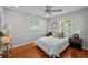 Bright bedroom features a ceiling fan and natural light from the windows at 3409 W El Prado Blvd, Tampa, FL 33629