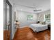 Bedroom features hardwood floors, natural light, a ceiling fan, and ample space at 3409 W El Prado Blvd, Tampa, FL 33629