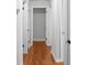 Hallway features hardwood floors, white trim, and neutral wall paint at 3409 W El Prado Blvd, Tampa, FL 33629