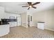 Bright kitchen with white cabinets, black backsplash, and unique tile flooring at 3409 W El Prado Blvd, Tampa, FL 33629