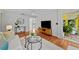 Cozy living room with stylish furniture, hardwood flooring, and decor. A doorway leads to the exterior at 3409 W El Prado Blvd, Tampa, FL 33629