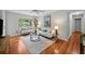 Well-lit living room with hardwood floors and stylish decor that creates a comfy and inviting atmosphere at 3409 W El Prado Blvd, Tampa, FL 33629