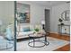 The light-filled living room is decorated with comfortable seating and is ready to entertain your guests at 3409 W El Prado Blvd, Tampa, FL 33629