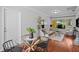 Stylish living room featuring hardwood floors, a glass table, and ample natural light at 3409 W El Prado Blvd, Tampa, FL 33629
