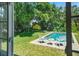 Private pool with lush, mature landscaping, perfect for relaxation and entertaining at 3409 W El Prado Blvd, Tampa, FL 33629