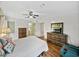 Bedroom featuring hardwood flooring, and an ensuite bathroom at 35026 Colony Hills Dr, Zephyrhills, FL 33541