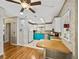 Bright kitchen with white cabinets, colorful lower cabinets, and modern appliances at 35026 Colony Hills Dr, Zephyrhills, FL 33541