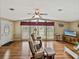 Comfortable living room with hardwood floors, large windows, and a relaxing atmosphere at 35026 Colony Hills Dr, Zephyrhills, FL 33541