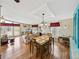 Open living space with dining area and cozy seating, flooded with natural light at 35026 Colony Hills Dr, Zephyrhills, FL 33541