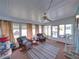 Enclosed sunroom featuring ample seating and natural light at 35026 Colony Hills Dr, Zephyrhills, FL 33541