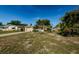 A cozy single-story home with a well-kept lawn, offering a welcoming curb appeal in a serene neighborhood at 3815 Bowen St, New Port Richey, FL 34652