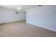 An empty living room with white walls, tile floors and a ceiling fan at 3815 Bowen St, New Port Richey, FL 34652