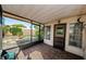 Screened patio featuring brick flooring, providing a relaxing outdoor space at 3815 Bowen St, New Port Richey, FL 34652