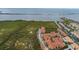 A scenic aerial view showcases the lush landscaping, terracotta roofs, and waterfront access of this condo complex at 4323 Bayside Village Dr # 229, Tampa, FL 33615