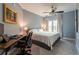Comfortable bedroom with a ceiling fan, carpet and a desk for working from home at 4323 Bayside Village Dr # 229, Tampa, FL 33615