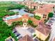 A picturesque aerial of the clubhouse, swimming pool, and manicured grounds offers resort-style living at 4323 Bayside Village Dr # 229, Tampa, FL 33615