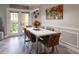 Dining room featuring a modern table, stylish chairs, and access to a balcony at 4323 Bayside Village Dr # 229, Tampa, FL 33615