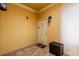 Welcoming entryway with tiled floor, a lantern-style wall light, and unit number at 4323 Bayside Village Dr # 229, Tampa, FL 33615