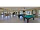 Bright and airy game room with pool tables, a piano, and comfortable seating at 4323 Bayside Village Dr # 229, Tampa, FL 33615