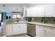 Well-maintained kitchen with stainless steel appliances and views into dining and living space at 4323 Bayside Village Dr # 229, Tampa, FL 33615