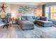 Comfortable living room boasts a plush sectional sofa, stylish decor, and a large window at 4323 Bayside Village Dr # 229, Tampa, FL 33615