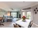 An open-concept living and dining area that offers lots of light from the sliding glass doors at 4323 Bayside Village Dr # 229, Tampa, FL 33615
