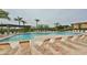 Inviting community pool with plenty of lounge chairs for relaxing by the water at 4323 Bayside Village Dr # 229, Tampa, FL 33615