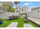 Relaxing backyard with outdoor kitchen, dining table, and lounge area for entertaining at 4522 W North B St, Tampa, FL 33609