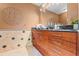 The bathroom vanity showcases dark countertops with plenty of drawers for storage at 4522 W North B St, Tampa, FL 33609