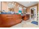A luxurious bathroom with and granite-top sinks and a tile surround shower offers lots of space at 4522 W North B St, Tampa, FL 33609
