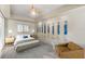 Cozy bedroom with a calming neutral palette, featuring a bed, and stylish decorations at 4522 W North B St, Tampa, FL 33609