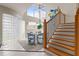 Bright dining area with glass block wall and wooden staircase at 4522 W North B St, Tampa, FL 33609