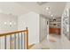 The upstairs hallway has tile floors and features a hall closet and an elegant light fixture at 4522 W North B St, Tampa, FL 33609