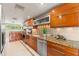 Stylish kitchen featuring stainless steel appliances and custom wood cabinetry at 4522 W North B St, Tampa, FL 33609
