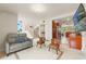 The living room has sleek tile floors, modern furniture, a staircase, and an open view to the kitchen at 4522 W North B St, Tampa, FL 33609