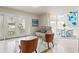 Bright living room with modern furniture, elegant tile floors, and glass doors leading to outdoor area at 4522 W North B St, Tampa, FL 33609
